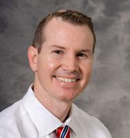 Mark E. Benson 